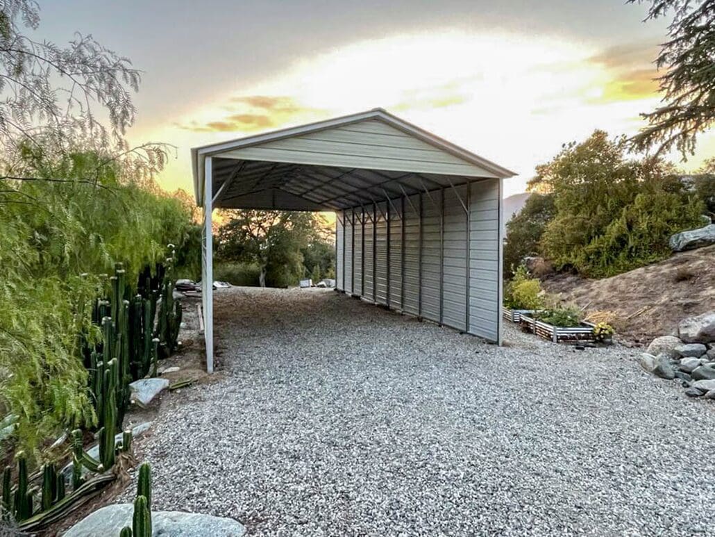 An RV cover over gravel